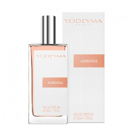 A pink Yodeyma Eau de Parfum bottle with the name Adriana written on it, alongside its white packaging box. a modern chypre-fruity fragrance that opens with luscious blackcurrant nectar (cassis), bergamot, and mandarin, then unfolds into a graceful heart of Rose de Mai, neroli, jasmine, and freesia. It finishes on a sophisticated base of patchouli, blond woods, amber, orcanox, and vanilla—radiating strength, elegance, and understated sensuality. Smells like: Si By Giorgio Armani.