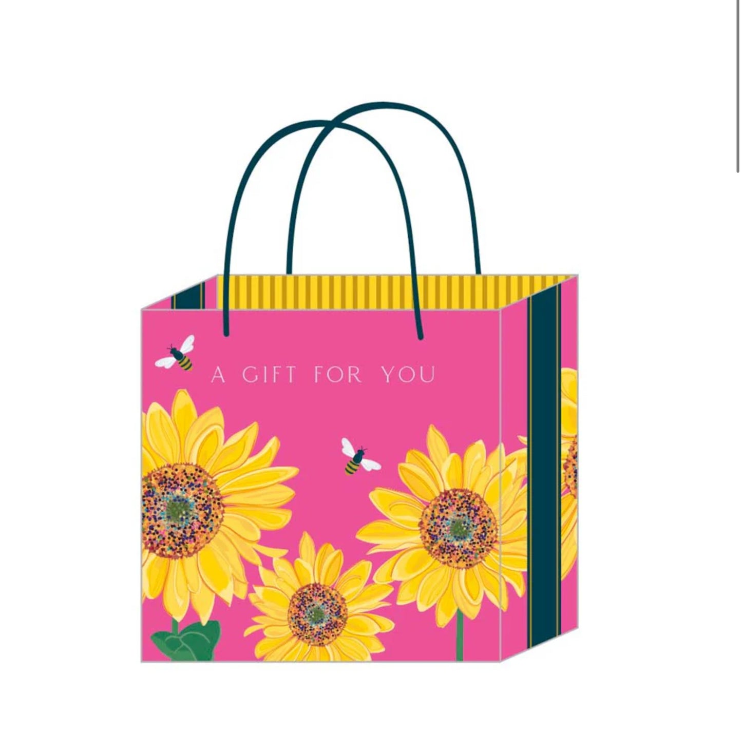 A rectangular gift bag with a pink background featuring a pattern of sunflowers and bees, with green and yellow stripes along the sides. It has a woven paper handle and a gift tag.