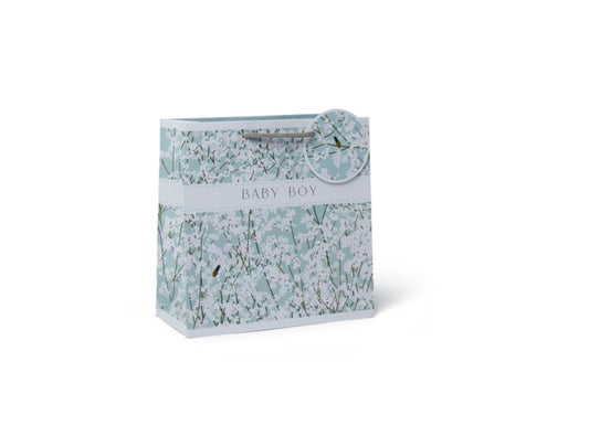 A medium-sized gift bag with a floral pattern in shades of blue and white, labeled 'Belly Button Designs' for a baby boy.