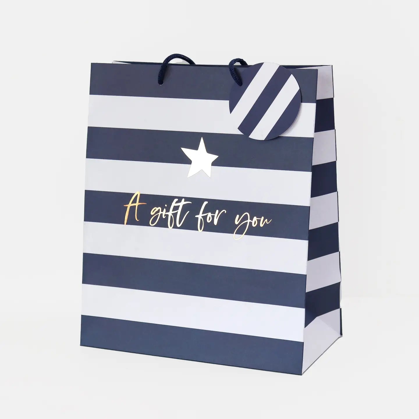 Navy and white striped gift bag with 'A gift for you' text and star design on a white background