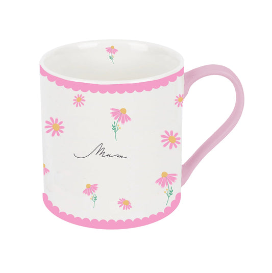 A small white china mug with pink flowers and the word 'MUM' written on it, surrounded by a pink decorative border.