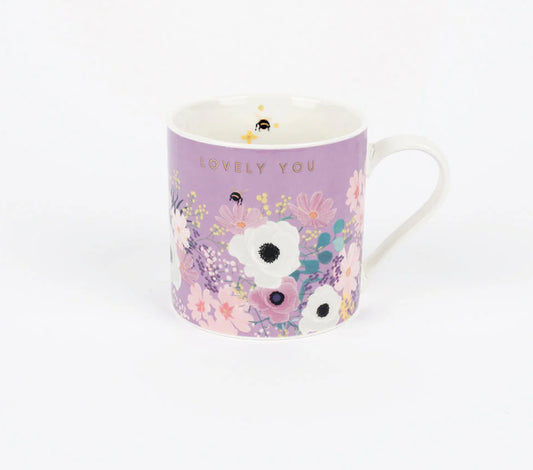 A purple Bone China mug with floral patterns and the phrase 'Lovely You' on the side.