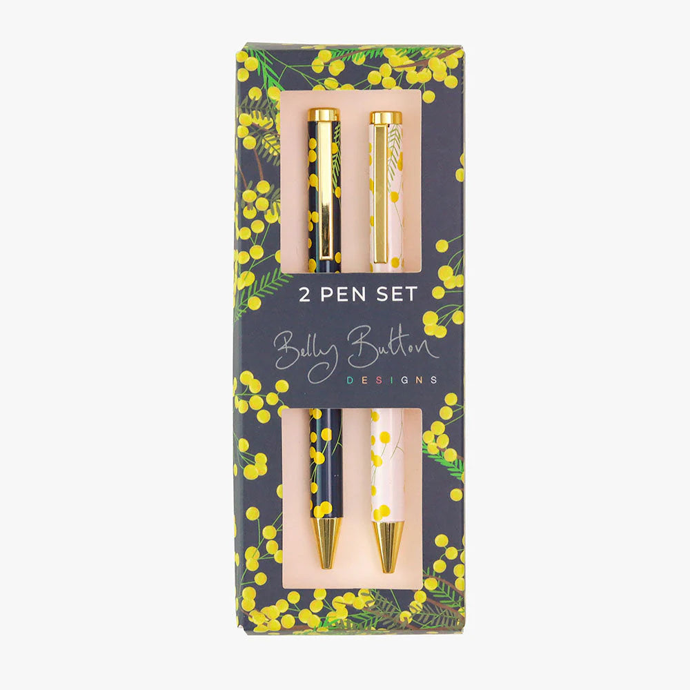 A set of two ballpoint pens with a gold and black design, featuring mimosa flower accents, presented in a gift box with a matching design.