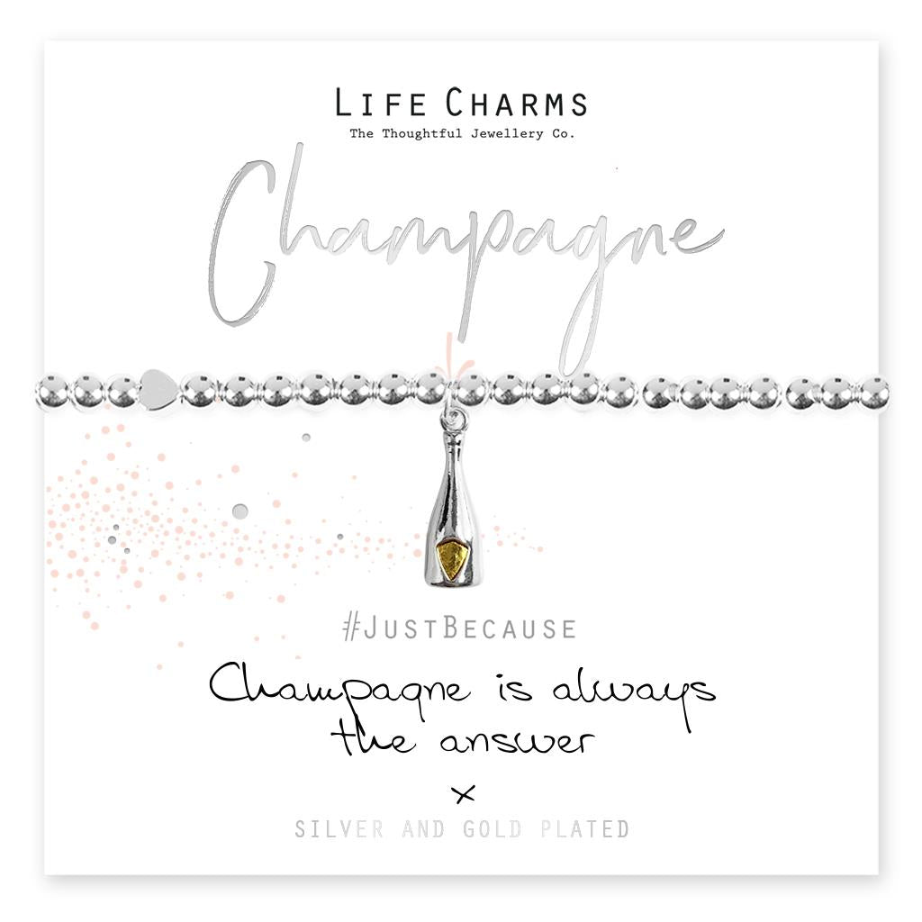 A silver and gold plated champagne bottle charm on a beaded stretch bracelet, presented in a luxury gift box with a 'Just Because Champagne is Always The Answer' card.