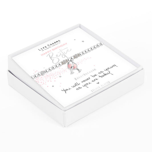 A silver-plated elastic bracelet with crystal beads and wine glass charms, presented in a white gift box with a written message.