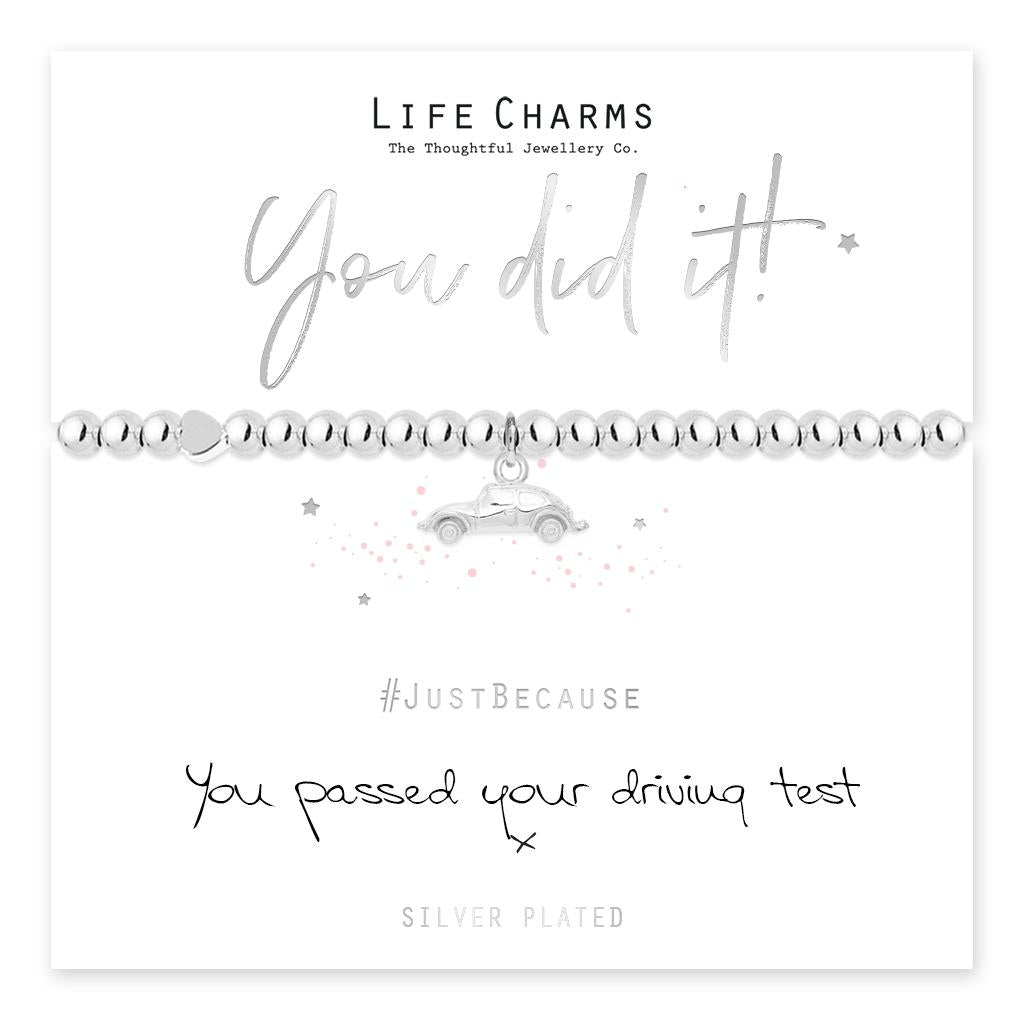 A silver-plated pug charm bracelet with 'You did it' text and a car icon, presented on a card with '#JustBecause' and 'SILVER PLATED' hashtags.