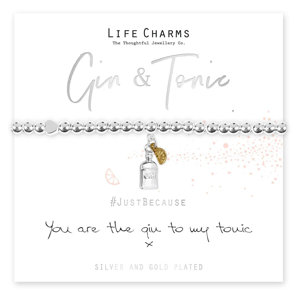 A silver-plated bracelet with a charm resembling a gin bottle and a lemon, presented on a card that reads 'Life Charms Gin & Tonic' and 'Just Because You Are The Gin To My Tonic!'.