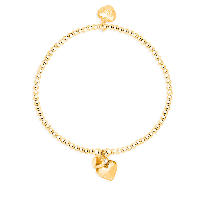 A gold-colored bracelet with a series of puffed heart charms of varying sizes attached to it, displayed against a white background.