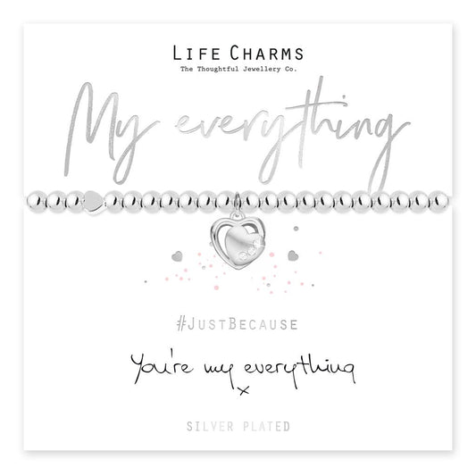 A silver-plated heart charm bracelet on a beaded stretch band, presented on a card that reads 'My everything' and '#JustBecause You're my everything'.