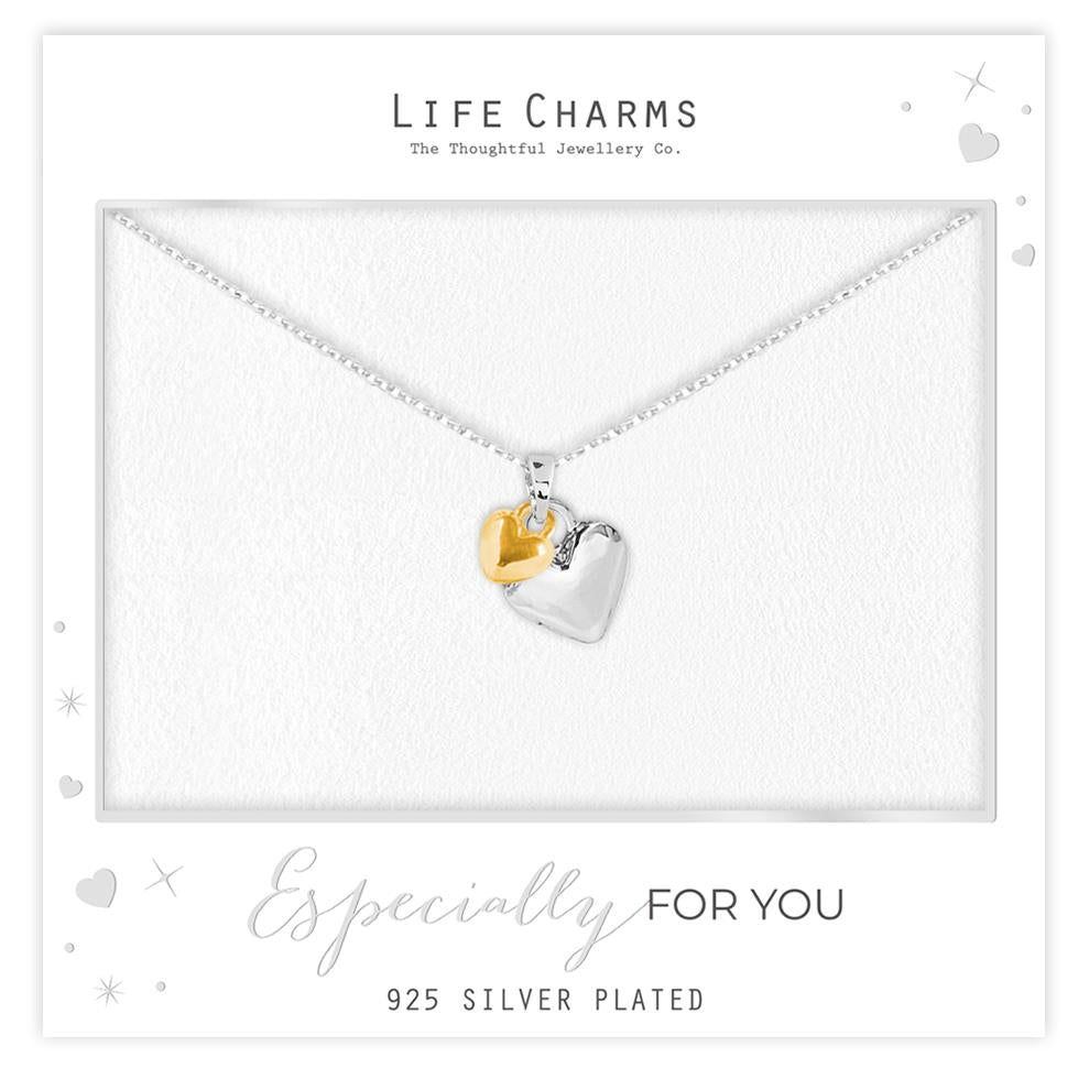 Necklace with heart-shaped pendants on a 'Life Charms' branded card.