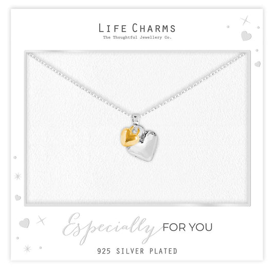 Necklace with heart-shaped pendants on a 'Life Charms' branded card.