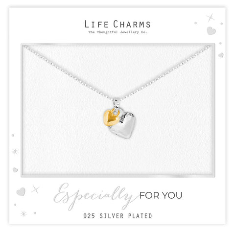 Necklace with heart-shaped pendants on a 'Life Charms' branded card.
