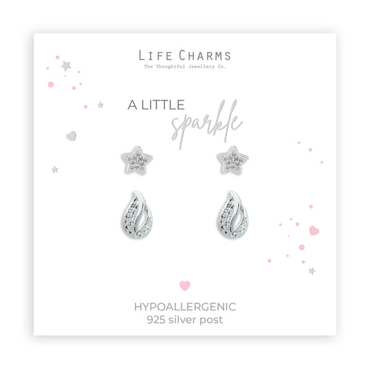 A set of silver-plated earrings featuring a star and drop design, packaged in a box with 'Life Charms' branding and a Christmas sleeve.
