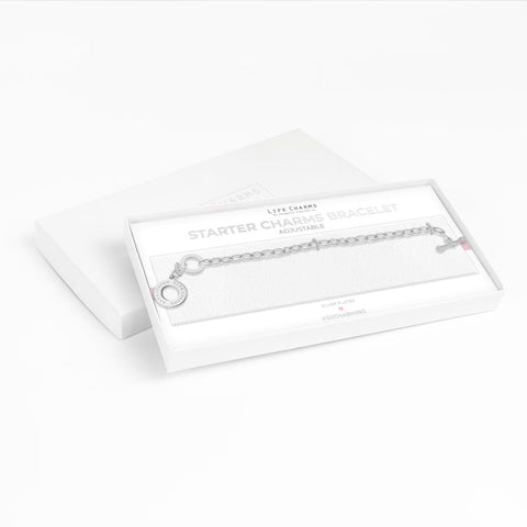 A silver plated chain bracelet with an engraved clasp, presented in a luxury gift box with the text 'STARTER CHARM BRACELET'.