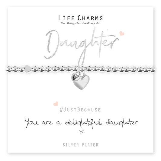 A silver-plated heart charm bracelet on a card with 'Daughter' written above it, and the brand 'Life Charms' below. The card has a message that reads '#JustBecause you are a delightful daughter', with the hashtag and the brand name.