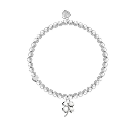 A silver-plated bracelet featuring a four-leaf clover charm on a beaded stretch band.
