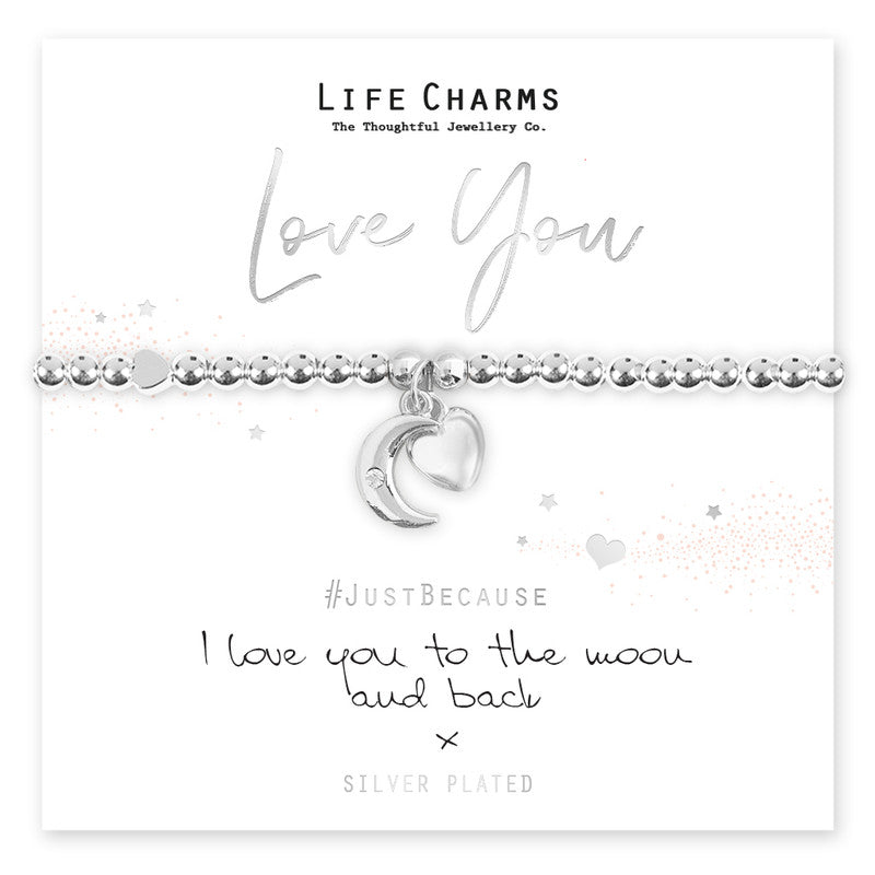 A silver plated bracelet with a puffed heart charm and a moon charm with a single cz stone, presented on a card with the text 'Love You' and 'I love you to the moon and back'.