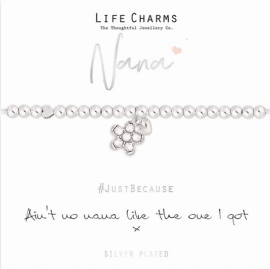 A silver-plated bracelet with a floral charm and heart accents, presented on a card that reads '#JustBecause' and ' Ain't no nana like the one I got'.