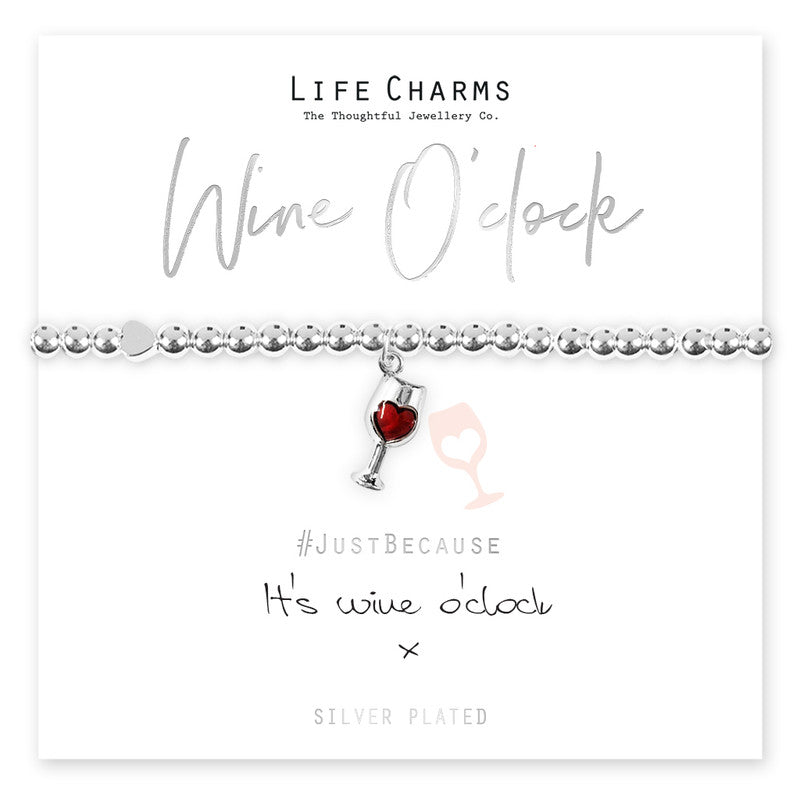 A silver-plated bracelet with a four leaf clover charm, presented on a card that reads 'Wine O'clock' and '#JustBecause It's wine o'clock'.