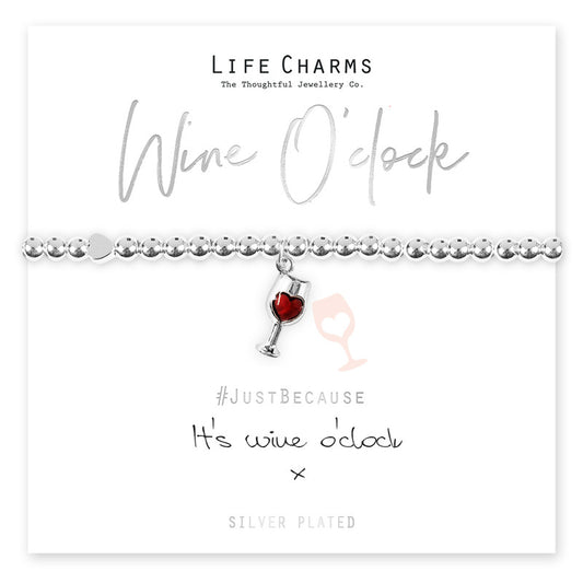 A silver-plated bracelet with a four leaf clover charm, presented on a card that reads 'Wine O'clock' and '#JustBecause It's wine o'clock'.